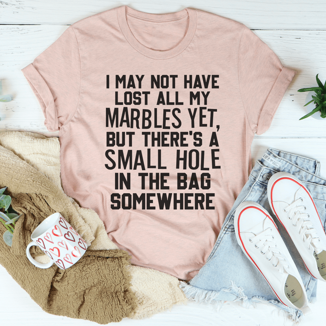 I May Not Have Lost All My Marbles Yet t-shirt in various colors, showcasing its soft fabric and durable stitching.